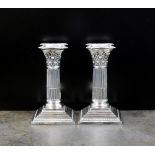 A pair of short silver Corinthian column candlesticks, Harrison Brothers & Howson,