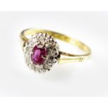 An 18ct gold pink sapphire and diamond cluster ring,