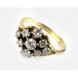 A nine stone diamond cluster ring,