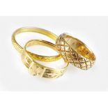 A 22ct gold wedding band, together with two 18ct gold bands, total weight 10.