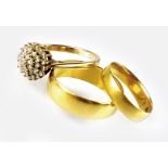 Two 22ct gold plain polished wedding bands, together with a 9ct gold diamond set cluster ring,