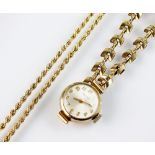 A lady's 9ct gold Enicar bracelet wristwatch, the circular silvered dial with gold Arabic numerals,