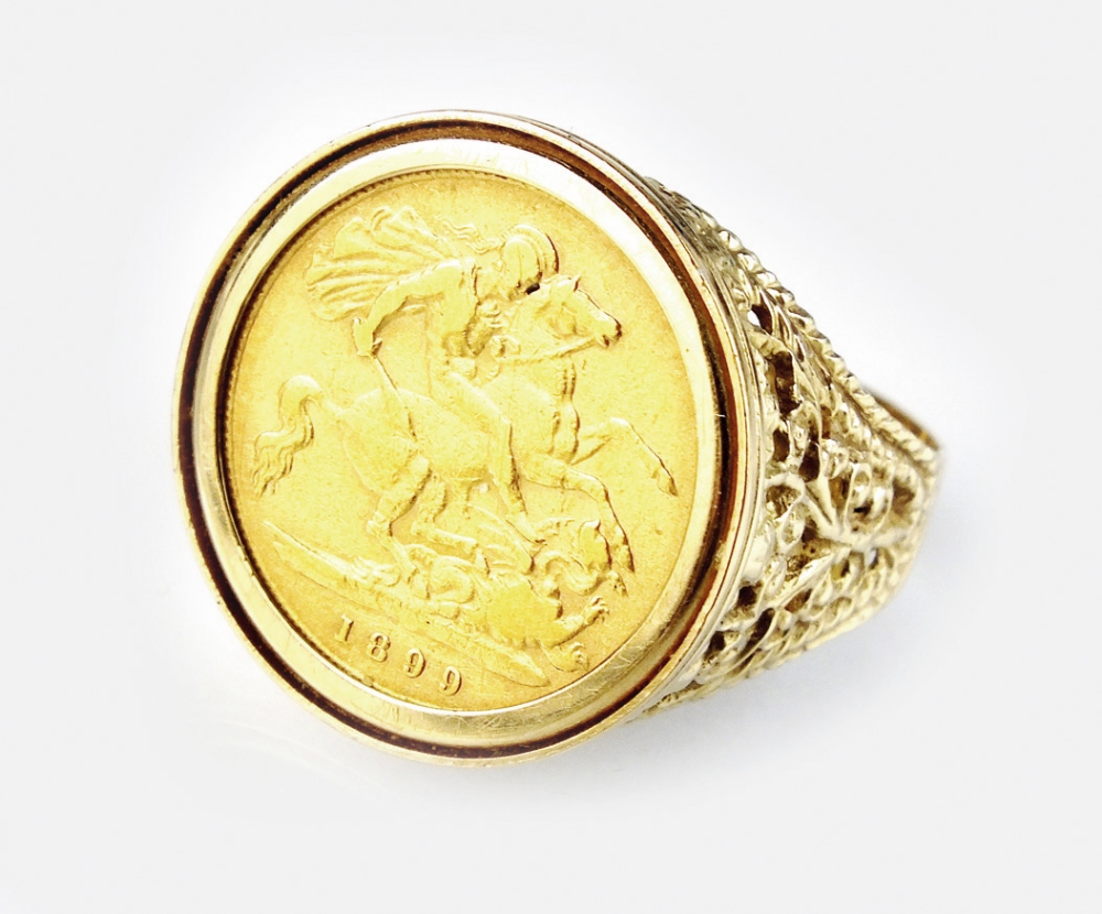 An 1899 half sovereign set ring, within decorative 9ct gold mount, ring size U, weight 9.