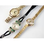 A lady's 9ct white gold and emerald set Eterna wristwatch, the circular silvered dial with batons,