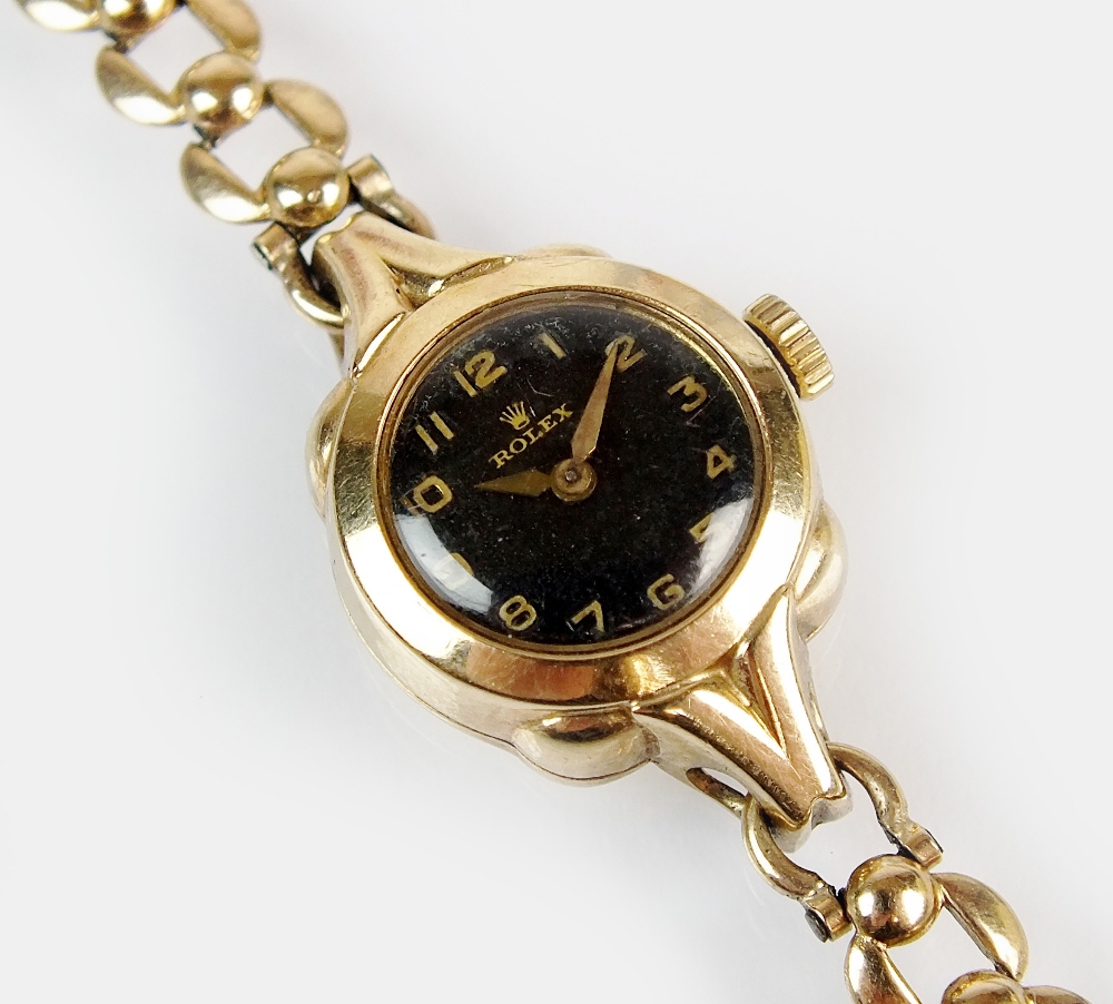 A lady's 9ct gold Rolex wristwatch, the circular black dial with gold Arabic numerals, manual wind, - Image 2 of 2