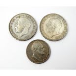 A William IV half crown, dated 1836, together with two George V crowns,
