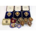 Eight Stallion Show Judges white metal and red enamel lapel badges, three within fitted cases,