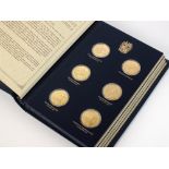 A cased set of twenty-four silver gilt Churchill medallions, by John Pinches,