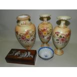 A Wiltshaw and Robinson Carlton ware blush ivory garniture printed and tinted with flowers,