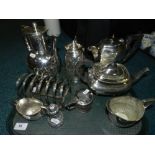 A group of electroplated wares to include tea pot, coffee pot, hot water jug,