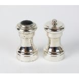 A pair of Cartier Sterling silver salt and pepper grinders/shakers,