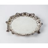 A silver waiter, Henry Stratford, London 1902, of circular form with shell and scroll rim,