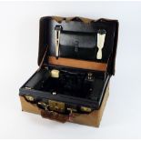 A cased travelling dressing table set,