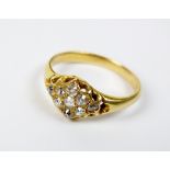 A nine stone diamond cluster ring,