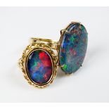 An oval opal triplet dress ring, the decorative pierced yellow metal shank stamped '375',