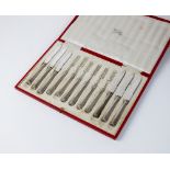 A cased set of twelve silver handled fruit knives and forks, Thomas Bradbury & Sons, Sheffield,