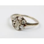 An early 20th century seven stone diamond cluster ring,
