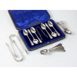 A cased set of six silver teaspoons with sugar tongs, Sheffield,
