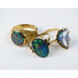 Two oval opal triplet dress rings, stamped '9ct' and '375',