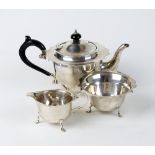 A three piece bachelors silver tea service, Barker Brothers, Chester 1920, 1923 & 1924,