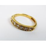 An 18ct gold seven stone diamond half hoop eternity ring, weight 3.