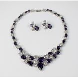 A purple and white cubic zirconia necklace,