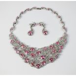 A pink and white cubic zirconia stylised feather necklace,