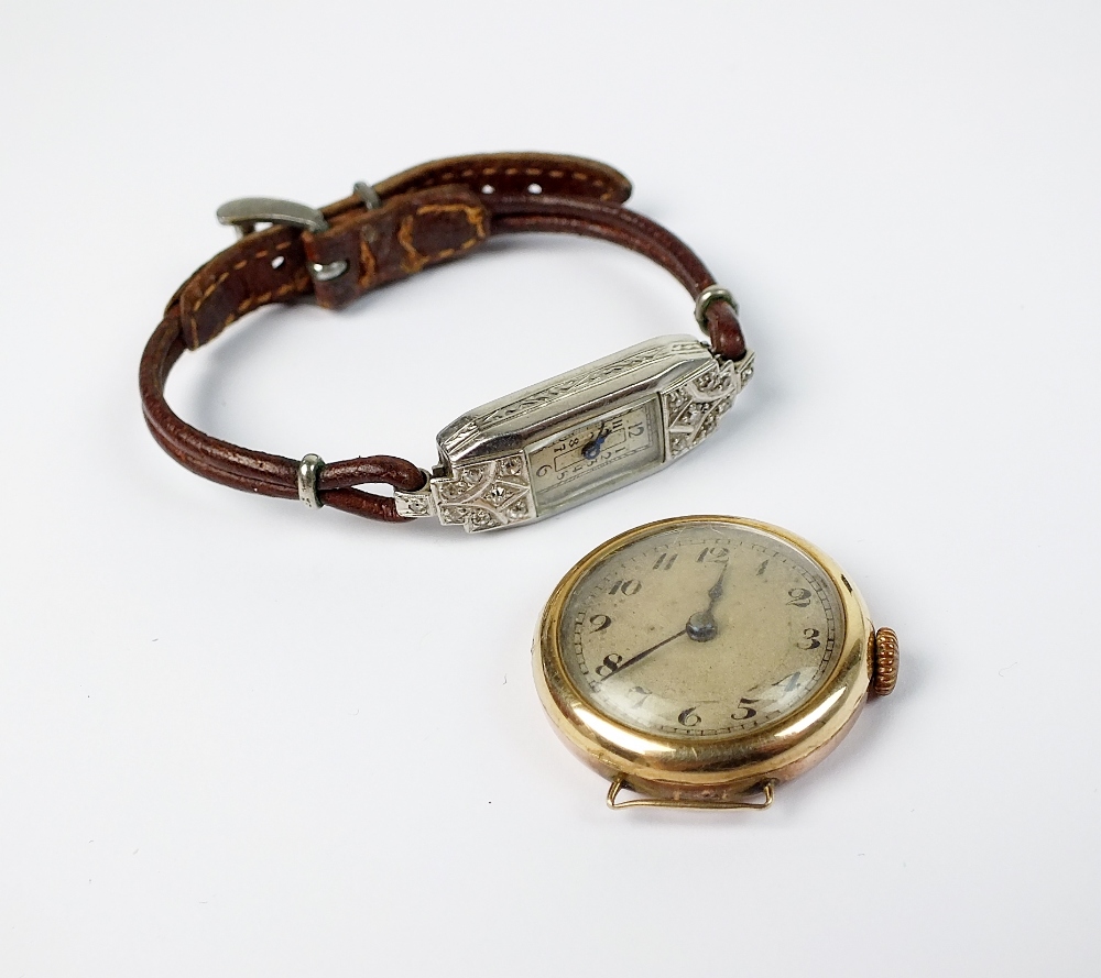 A lady's Art Deco diamond set wristwatch, with brown leather strap,
