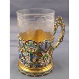 A Russian teaglass with silver gilt holder having fine shaded cloisonne enamel decoration.