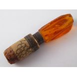 An amber mounted bottle stopper, the amb