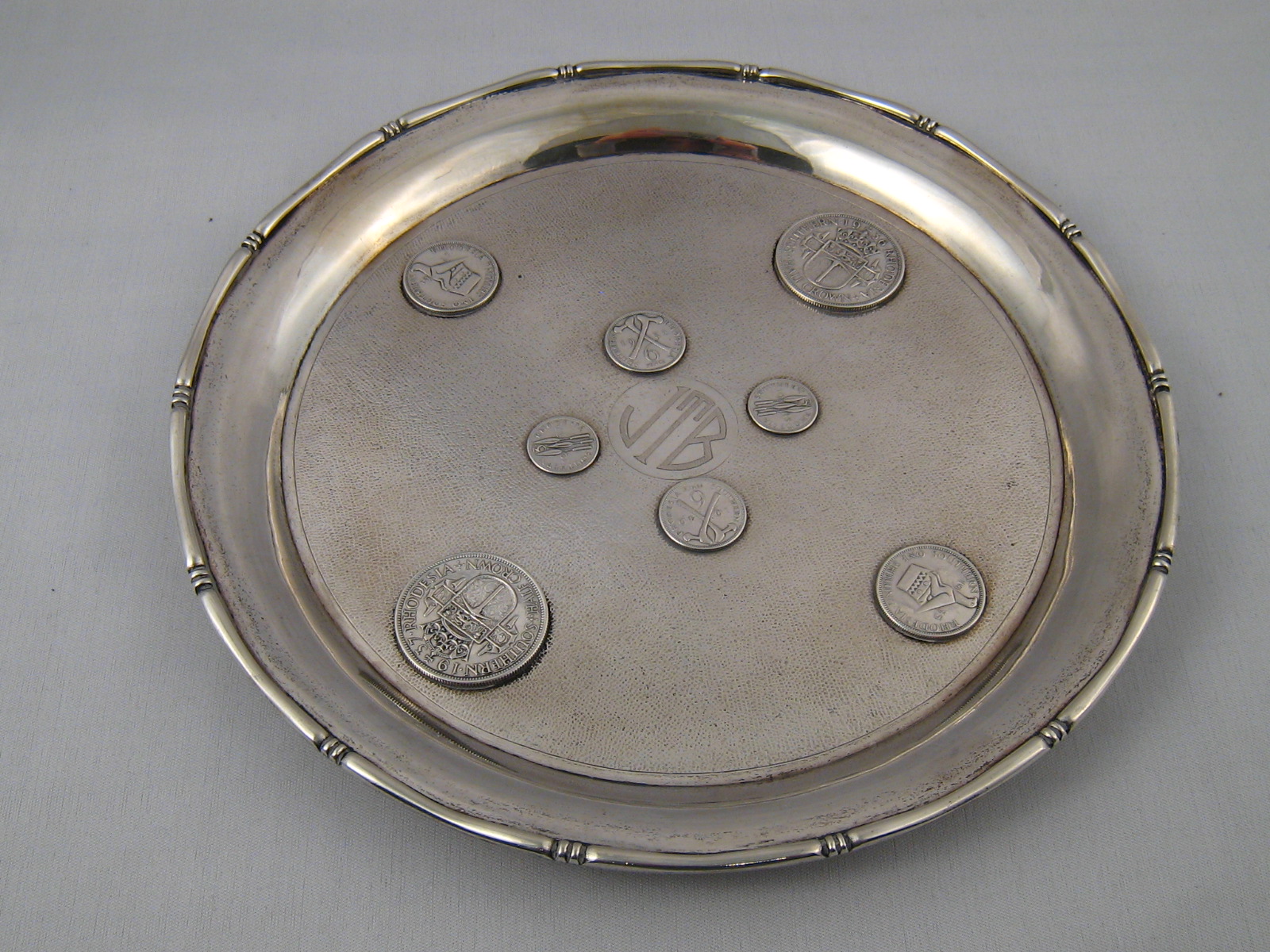 A small Chinese silver salver with stiff