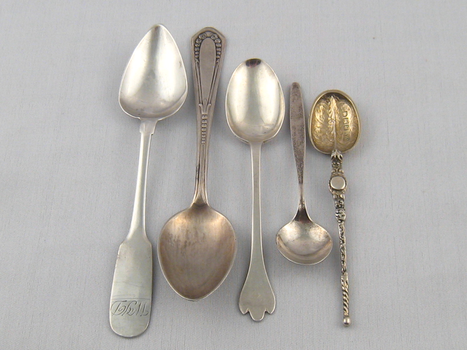 Four silver teaspoons, comprising a Geor