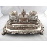 An Old Sheffield Plate "Treasury" inkstand on paw feet with applied rococo decoration and two cut