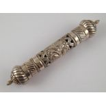 A silver scroll holder, marked" silver 9