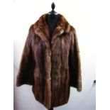 A light brown mink coat, approx. 80 cm l