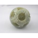 A Chinese hardstone puzzle ball of four