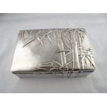 A Chinese silver cigarette case, the matted finish with embossed bamboo decoration, a presentation