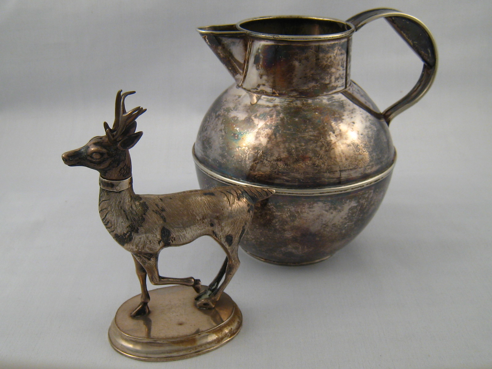 A silver plated stag container with remo