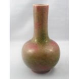 A Chinese vase with tall neck and variegated green and red mottled glaze, chip to inside of base