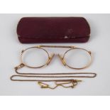 A pair of antique gilt metal spectacles.