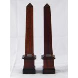 A pair of mahogany square obelisks, ht.