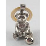 A silver teddy bear rattle with bell and