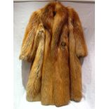 A red fox fur coat with vintage lining,