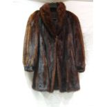 A mink coat, 59 cm across x 95 cm long.