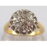 An 18 carat gold diamond cluster ring, e