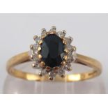 A 9 carat gold sapphire and diamond ring