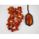 A large antique / vintage amber pendant,