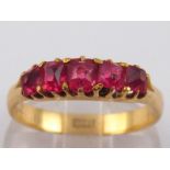 An 18 carat gold five stone red spinel r