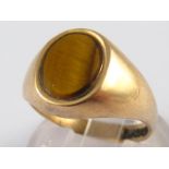 A 9 carat gold tiger's eye ring, size O,