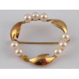 A 9 carat gold and cultured pearl brooch